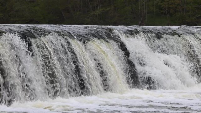 Kuldiga, Latvia Water flowing over the Venta River waterfall, the widest in Europe, 270 meters wide. 