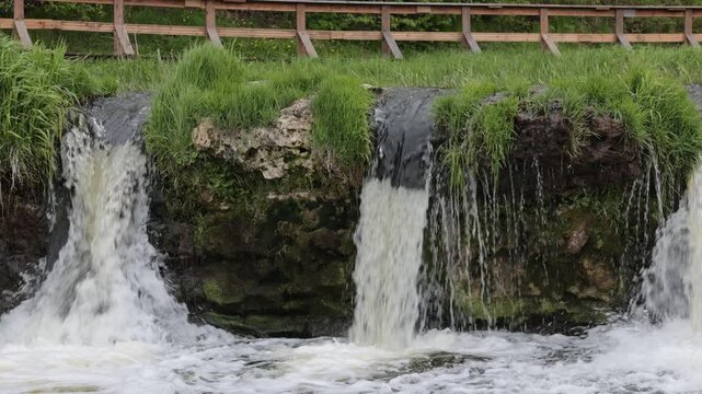 Kuldiga, Latvia Water flowing over the Venta River waterfall, the widest in Europe, 270 meters wide. 