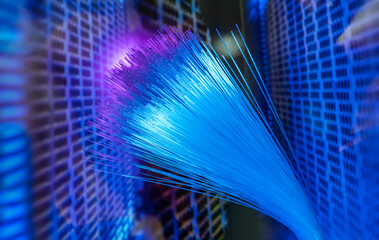 Fiber optics network cable on technology background