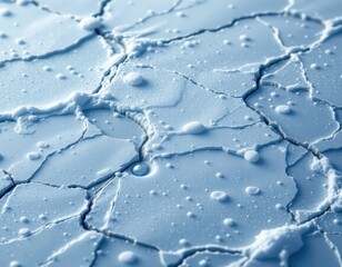 create a realistic ice surface close up image featuring a single drop of water falling from the top to the bottom of the frame