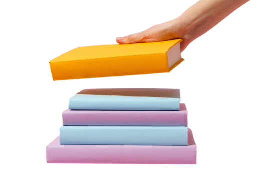 Hand places a yellow book atop a stack of colorful study materials, isolated on white, PNG