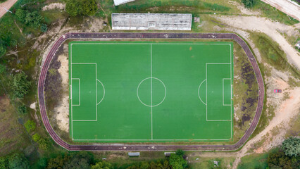 campo de futbol en zona rural de oaxaca de juarez, chalcatongo en zona de terraceria y campo, pista de atletismo de gravilla roja  © EduardoMartin