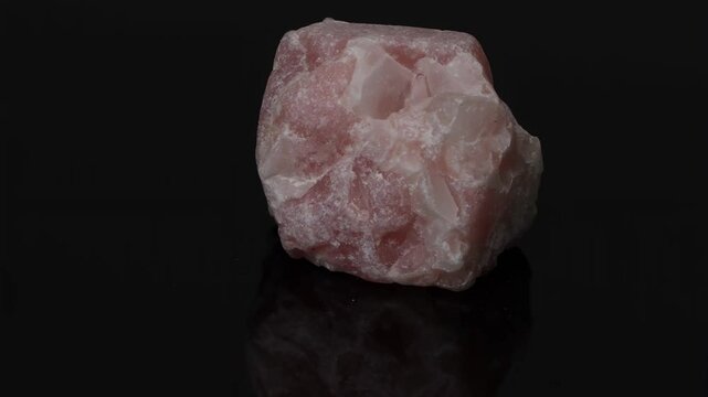 Close-Up of Pink Mineral on Reflective Surface