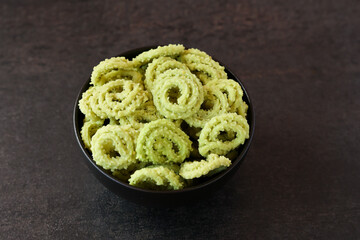 Rice murukku , savoury , chakli, chakali Indian milk tea chai Kerala snack deep fried coconut oil traditional South Indian Tamil Nadu India, Sri Lanka, Onam, Vishu, Diwali Deepawali, Ramadan, Eid