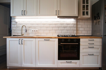 A beautiful kitchen detail with white cabinets