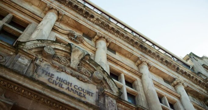 Below, building and court for justice or law, judicial with traditional architecture for legal place. Landmark, structure and location for legislation, litigation or magistrate courthouse in city