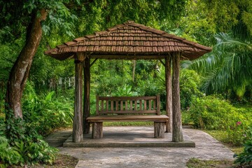 Obraz premium Wooden gazebo with bench in lush garden