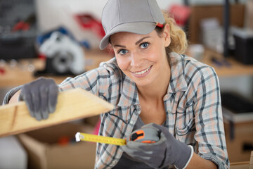 female carpenter at work in warehouse