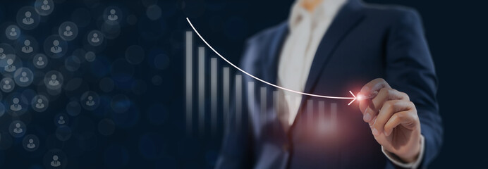 Business decline and workforce reduction concept. Staff downsizing, reduce manpower, and redundant labor. Drawing a downward trending graph, symbolizing financial loss, layoffs or workforce downsizing