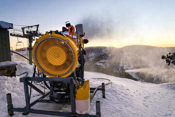 snow making machines at sunrise
