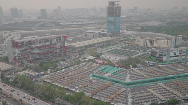 A view of Chatuchak Weekend Market from above, with the backdrop of a building under construction before it collapsed in the Bangkok earthquake.