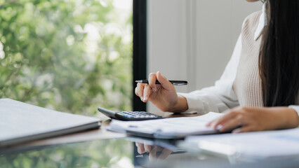 Woman Analysis Business Accounting working with Individual income tax return Accounting concept