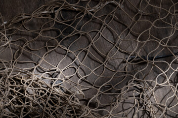 Fishing net on rustic old wood, fishing concept, art craft themes
