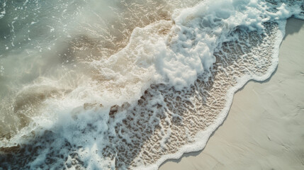 Fototapeta premium Soft ocean waves gently lapping on white sand beach create serene atmosphere, inviting relaxation and tranquility. rhythmic motion of water enhances peaceful setting