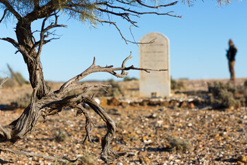 Old headstone in abandoned cemetery