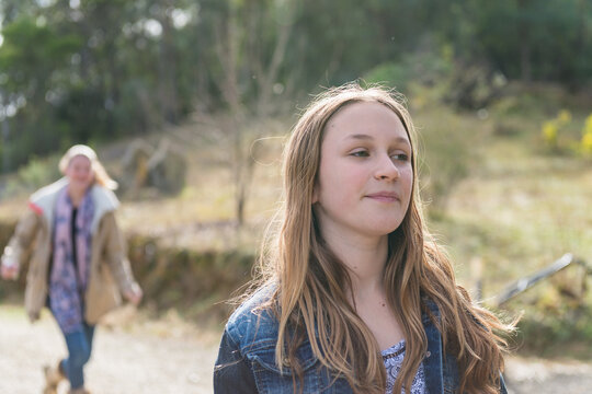 young teen pulling a face as she waits for another teen