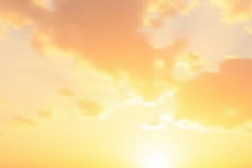 Orange Golden Sky Background. The sky ablaze with a symphony of warm hues and soft textures as the sun descends, casting a breathtaking display of natural artistry.