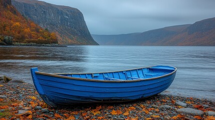 Fototapeta premium Blue boat on colorful autumn shore
