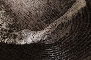 Textured stone ceiling surface with visible lines and intriguing shadows