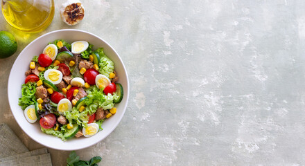 Salad with tuna, eggs, tomatoes, cucumbers and corn. Healthy eating. Diet.