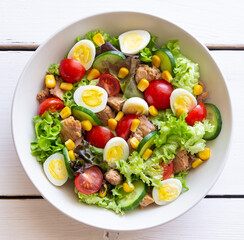Salad with tuna, eggs, tomatoes, cucumbers and corn. Healthy eating. Diet.