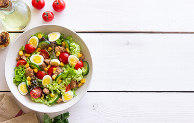 Salad with tuna, eggs, tomatoes, cucumbers and corn. Healthy eating. Diet.