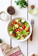 Salad with tuna, eggs, tomatoes, cucumbers and corn. Healthy eating. Diet.