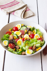 Salad with tuna, eggs, tomatoes, cucumbers and corn. Healthy eating. Diet.