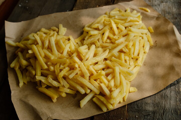 Love of fast food. French fries laid in shape of heart. 