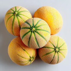 Cantaloupe Melon Harvest: A group of vibrant, freshly harvested cantaloupe melons with their distinctive green netting and juicy flesh.