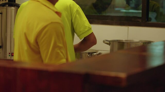 Preparing a warm bowl of ginger ronde in Bandung. Ronde is a traditional Peranakan dessert popular in Bandung, Indonesia, made with glutinous rice balls served in sweet ginger broth.