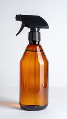 A sleek brown spray bottle featuring a sturdy black trigger, perfect for dispensing liquids, set against a clean, neutral background for emphasis.