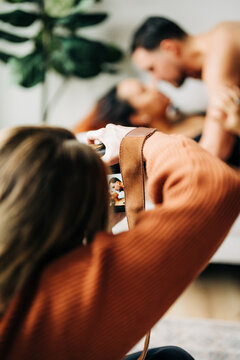 Photographer captures intimate couple moment on camera during shoot