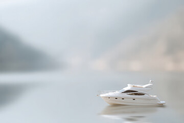 Fototapeta premium elegant yacht gliding on calm water with single person onboard embodying harmony and tranquility