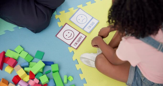 Hands, speech or therapist with child, cards or adhd with education, questions or help. Sad, happy and above of girl kid in therapy with counseling evaluation, wellness assessment and mood choice