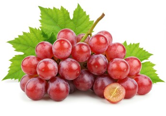 Fototapeta premium Fresh red grapes with green leaves on a white background, one grape cut in half