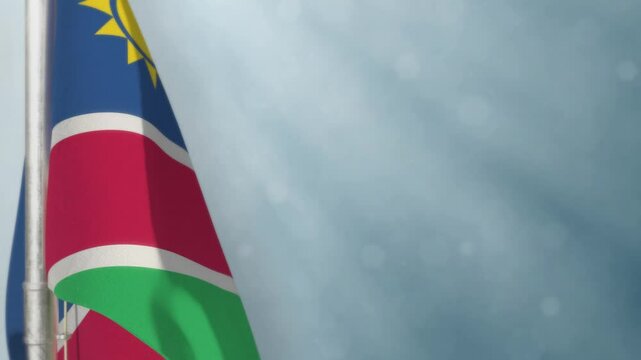 Waving Namibia flag on light blue bokeh backdrop