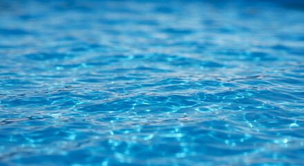 Shimmering blue water ripples in sunlight