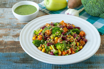 A light, summer dish made of buckwheat, red beans, broccoli, sweet potatoes and pesto sauce