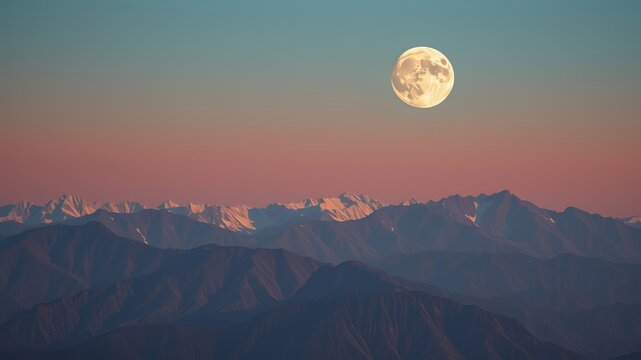 A full moon rises majestically over a breathtaking range of snow capped mountains at dusk creating a serene and magical landscape.