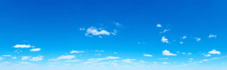 Obraz premium Blue Sky background with tiny Clouds. Panorama background