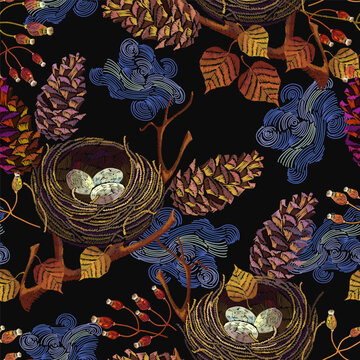 Embroidery. Autumn leaves, fircones and nest egg. Seamless pattern. Fall nature style. Fashionable template for design of clothes. September forest art