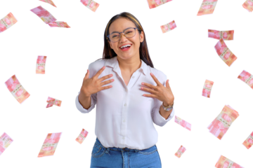 Cheerful young Asian woman rejoicing success with money banknotes flying in the air isolated on transparent background