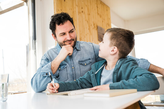 Father and son spending quality time together indoors