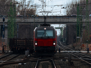 Obraz premium Red freight train on complex railway junction 