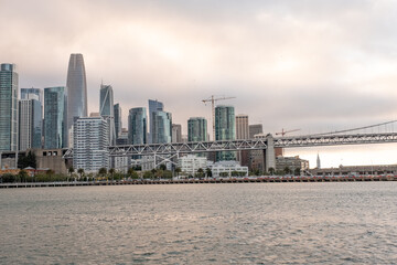 Obraz premium Lower perspective of San Francisco skyline showing Salesforce Tower and adjacent buildings rising above the bay – San Francisco, CA on May 11, 2019