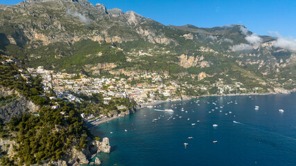 Obraz premium Panoramic aerial view of the Amalfi Coast, in the province of Salerno, Campania, Italy. In the center of the panorama there is the town of Positano, one of the most touristic and beutiful destinations