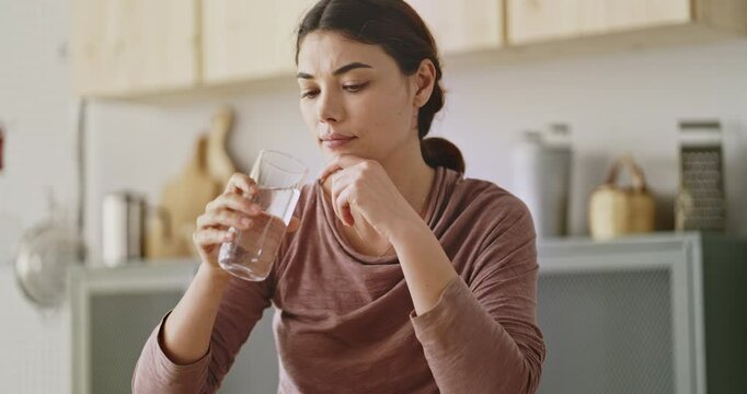 Looking at a glass of dirty water with suspicion