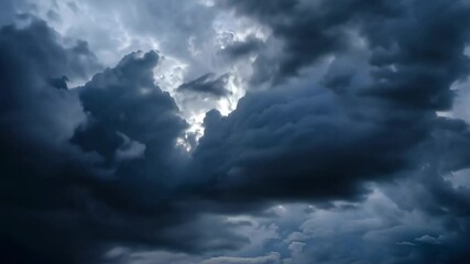 Rolling masses twist across sky, storm clouds flash silver gaps, storm clouds rumble unseen thunder, storm clouds reveal nature’s might. Concept of raw power.