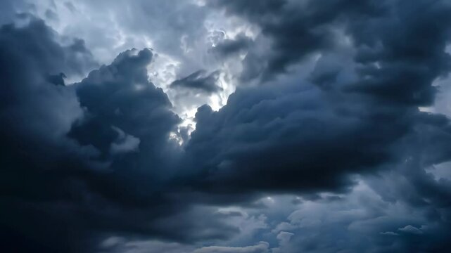 Rolling masses twist across sky, storm clouds flash silver gaps, storm clouds rumble unseen thunder, storm clouds reveal nature&rsquo;s might. Concept of raw power.